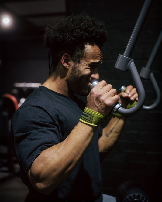 man using upper body gym machine