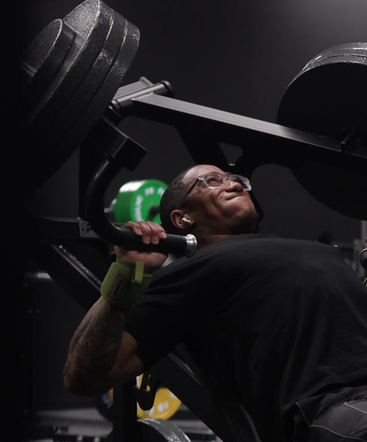 man working out hard wearing uppper wrist wraps