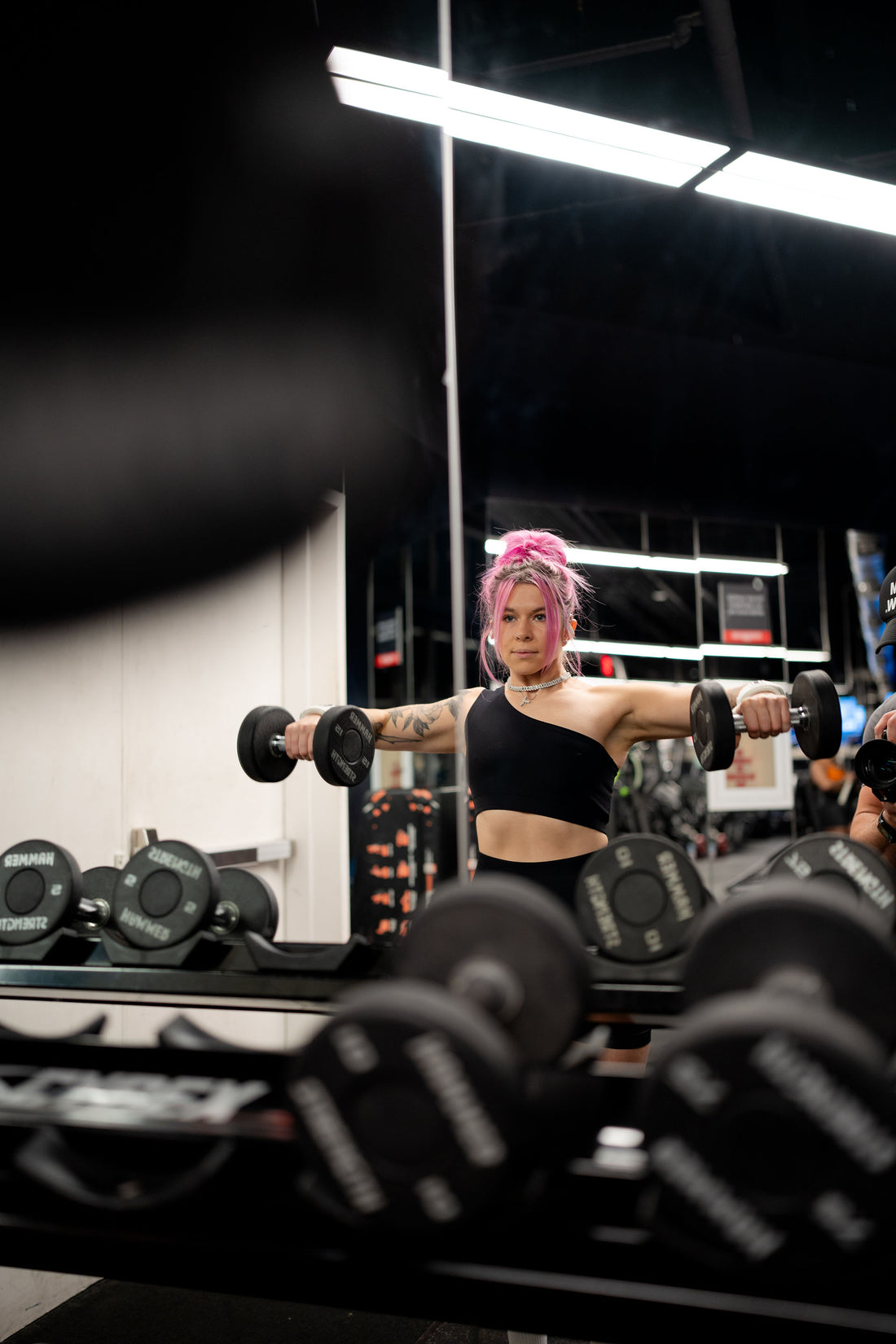 woman doing dumbbell exercise